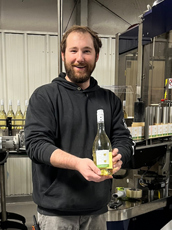 Assistant Winemaker Brad Ulrich with 2022 La Crescent